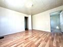 Spacious bedroom with wood-look flooring and an additional room at 1750 Linden St, Indianapolis, IN 46203