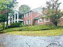 Brick house exterior with a driveway at 7722 Shady Hills W Dr, Indianapolis, IN 46278