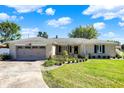 Brick ranch house with attached garage and manicured lawn at 3005 Olive Branch Rd, Greenwood, IN 46143