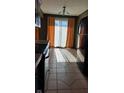 Simple kitchen with tile floor and sliding doors at 2721 Del Prado Dr, Indianapolis, IN 46227