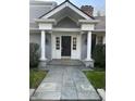 Inviting home exterior with a classic design, a covered entryway, and a stone walkway at 9510 Copley Dr, Indianapolis, IN 46260