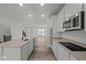 Modern kitchen with stainless steel appliances and light-colored cabinetry at 4231 Barrel Ln, Westfield, IN 46062