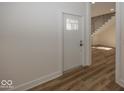 Bright entryway with white door and hardwood floors at 1666 Union St, Indianapolis, IN 46225