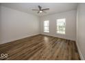 Spacious bedroom with hardwood floors and two windows at 1666 Union St, Indianapolis, IN 46225