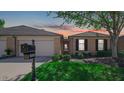 Brick front of a charming twin home with landscaping at 1053 Millwood Ct # 3, Indianapolis, IN 46260
