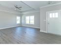 Spacious living room with gray flooring and neutral walls at 4435 W Preserve Pass, New Palestine, IN 46163