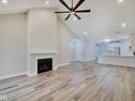 Open living room with high ceilings, fireplace and kitchen view at 2843 Grandview Ln, Greenwood, IN 46143