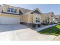 Two-car garage with white door and concrete driveway at 4435 W Preserve Pass, New Palestine, IN 46163