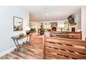 Bright and spacious entryway with hardwood floors and views into the living room and dining area at 11730 Ansley Ct, Zionsville, IN 46077