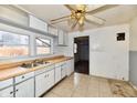 dated kitchen features worn countertops and cabinets at 214 Tippecanoe Dr, Noblesville, IN 46062
