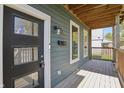 Covered front porch with wood flooring at 628 N Beville Ave, Indianapolis, IN 46201