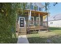 Two-story craftsman home with front porch at 628 N Beville Ave, Indianapolis, IN 46201