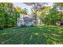 Gray house with a large yard and mature trees at 6438 Pin Oak Dr, McCordsville, IN 46055