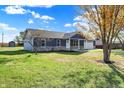 Ranch home with stone accents and a two-car garage at 7234 N Christopher Ln, Fairland, IN 46126