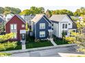 Three new homes in a row, red, navy, and white at 1327 E 11Th St, Indianapolis, IN 46202