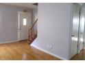 Bright entryway with hardwood floors and staircase at 6338 Douglas Rd, Indianapolis, IN 46220