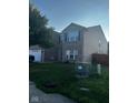 Two-story home with a front yard and driveway at 1449 Danielle Dr, Indianapolis, IN 46231