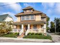 Two story house with front porch and brick steps at 814 E 23Rd St, Indianapolis, IN 46205