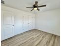 Spacious bedroom featuring hardwood floors and double door closets at 1441 Coen Ct, Columbus, IN 47201