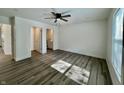 Bright bedroom with wood-look floors and an ensuite bathroom at 1441 Coen Ct, Columbus, IN 47201