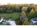 Aerial view of property with large yard, showing house and outbuildings at 3231 W State Road 32, Westfield, IN 46074