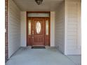 Rich wooden front door with glass accents at 7189 Lockford N, Avon, IN 46123