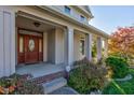 Elegant front door with sidelights and a brick stoop at 7189 Lockford N, Avon, IN 46123