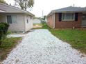 Gravel driveway between two houses at 309 S Fleming St, Indianapolis, IN 46241