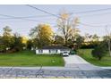Aerial view of a house with a yard, driveway, and surrounding trees at 3837 W State Road 32 W W, Westfield, IN 46074
