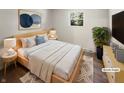 Virtually staged bedroom with light wood furniture and a neutral color scheme at 926 Stockton St, Indianapolis, IN 46260