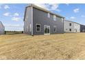 Gray house exterior with sliding glass doors and a grassy yard at 250 Mcnair Rd, Whiteland, IN 46184