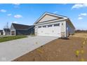 Detached two-car garage with a white door at 420 Charles Freer Ln, Whiteland, IN 46184