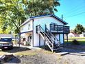 Two-story home with a deck and stairs at 290 W Washington St, Martinsville, IN 46151