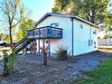 Two-story home with a deck, stairs and yard at 290 W Washington St, Martinsville, IN 46151
