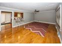 Hardwood floors, red and brown zig zag rug, and kitchen view at 7060 S Meridian St, Indianapolis, IN 46217