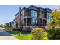 Brick front exterior with gray accents and a porch at 456 Monon Way Dr, Carmel, IN 46032