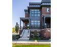 Brick front exterior with gray accents and a porch at 456 Monon Way Dr, Carmel, IN 46032