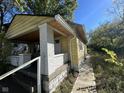 Yellow bungalow with side porch and walkway at 3221 E 38Th St, Indianapolis, IN 46218