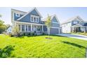 Two-story home with gray siding, landscaping, and a two-car garage at 53 Hampstead Ct, Westfield, IN 46074