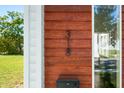 House number 318 on a modern wood exterior at 318 N Tacoma Ave, Indianapolis, IN 46201