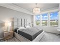 Spacious main bedroom with plush bed and water views at 802 Weldon Way, Westfield, IN 46074