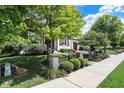 Attractive home exterior with manicured lawn and landscaping at 15571 Bridgewater Club Blvd, Carmel, IN 46033