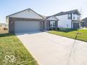 Newly built home with a two-car garage and a spacious front yard at 6105 Card Blvd, Indianapolis, IN 46221