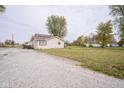 House exterior with gravel driveway and yard at 216 E Elm St, Jamestown, IN 46147