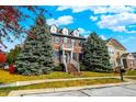 Brick two-story house with landscaping and a walkway at 7178 Lockford N, Avon, IN 46123