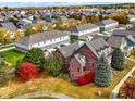 Aerial view of house and surrounding neighborhood in autumn at 7178 Lockford N, Avon, IN 46123