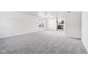 Spacious living room with gray carpeting and an open floor plan at 4633 Angelica Dr, Indianapolis, IN 46237
