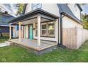 Newly built porch with wood flooring, creating a welcoming entrance at 2221 E Michigan St, Indianapolis, IN 46201