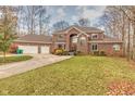 Brick house with two car garage and autumn landscaping at 808 Copperfield Xing, Danville, IN 46122