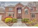 Brick home with a large front door and landscaping at 808 Copperfield Xing, Danville, IN 46122